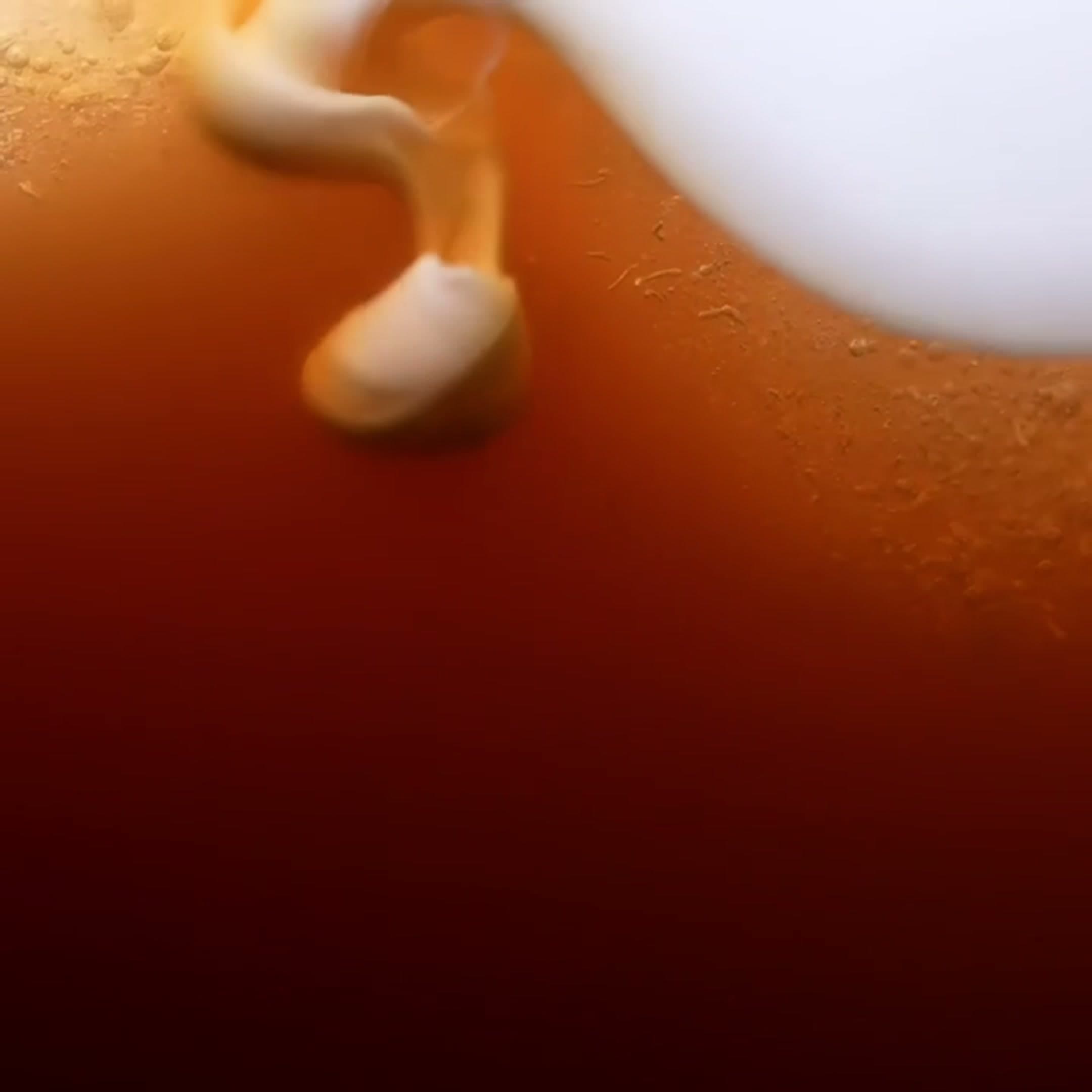 Cold coffee pouring into a glass